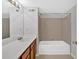 Bathroom featuring tile flooring and a tub and shower combination with tile surround at 713 Shore Ln, Lithonia, GA 30058