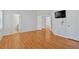 Light-filled bedroom featuring hardwood floors, light walls, and natural light at 713 Shore Ln, Lithonia, GA 30058