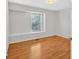 Light and airy bedroom with hardwood floors and natural light at 713 Shore Ln, Lithonia, GA 30058
