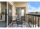 Private balcony features seating for two, and sliding door into kitchen at 1 Biscayne Nw Dr # 211, Atlanta, GA 30309
