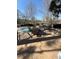 Outdoor deck with dining set, perfect for entertaining overlooking a community pool at 1 Biscayne Nw Dr # 211, Atlanta, GA 30309