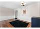 Elegant dining room features hardwood floors, wainscoting, and a modern light fixture at 1 Biscayne Nw Dr # 211, Atlanta, GA 30309