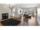 Spacious living room with hardwood floors, bar stool seating, and an open floor plan at 1 Biscayne Nw Dr # 211, Atlanta, GA 30309
