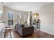 Inviting living room boasts hardwood floors, natural light, and a comfortable couch at 1 Biscayne Nw Dr # 211, Atlanta, GA 30309