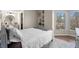 Bedroom featuring a neutral color palette and windows allowing for an abundance of natural light at 1 Biscayne Nw Dr # 211, Atlanta, GA 30309