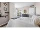 Bedroom featuring a neutral color palette, wood floors and sliding glass door out to a balcony at 1 Biscayne Nw Dr # 211, Atlanta, GA 30309