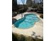 Inviting community pool surrounded by lush landscaping and a secure fence at 1 Biscayne Nw Dr # 211, Atlanta, GA 30309