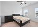 Bedroom with plush carpeting, a ceiling fan, and a window provides a comfortable space at 3260 Bennett Creek Ln, Suwanee, GA 30024