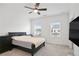 Bright bedroom with carpet, a ceiling fan, and lots of natural light creates a relaxing space at 3260 Bennett Creek Ln, Suwanee, GA 30024