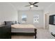 Bedroom with carpet, a ceiling fan, and lots of natural light provides comfort at 3260 Bennett Creek Ln, Suwanee, GA 30024