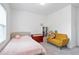 Bright bedroom features a twin bed, sofa, and dresser at 3260 Bennett Creek Ln, Suwanee, GA 30024