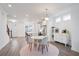 Bright and airy open concept living and dining area featuring hardwood floors at 3260 Bennett Creek Ln, Suwanee, GA 30024