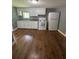 The kitchen features classic white cabinets, stainless steel sink, gas range and refrigerator at 5160 Avery St, Covington, GA 30014