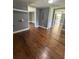 Open living room with hardwood floors that flow to other rooms in this airy home at 5160 Avery St, Covington, GA 30014