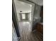 Inviting living area featuring a spacious layout, gray walls, and gray wood floors at 5160 Avery St, Covington, GA 30014