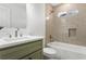 Bathroom featuring a tub with tile surround, shower, and a vanity with modern fixtures at 1020 Pinedale Se Dr, Smyrna, GA 30080