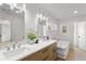 An elegant primary bathroom featuring double vanities, tub, and natural light at 1020 Pinedale Se Dr, Smyrna, GA 30080