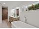 A luxurious primary bathroom featuring a soaking tub, double vanity, and walk-in shower at 1020 Pinedale Se Dr, Smyrna, GA 30080