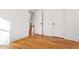Bright bedroom with wood floors, white trim, and white doors at 1020 Pinedale Se Dr, Smyrna, GA 30080