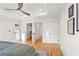 A bedroom featuring doors to the closet and bathroom with hardwood floors at 1020 Pinedale Se Dr, Smyrna, GA 30080