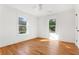 Bright bedroom features hardwood floors, two windows, and neutral walls, offering a serene and inviting space at 1020 Pinedale Se Dr, Smyrna, GA 30080