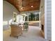 Cozy covered patio with stone fireplace, ceiling fan and a seating area at 1020 Pinedale Se Dr, Smyrna, GA 30080