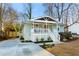 Charming bungalow-style home with a covered front porch and a long driveway at 1020 Pinedale Se Dr, Smyrna, GA 30080