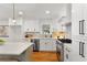 This bright kitchen is equipped with stainless steel appliances and white countertops and cabinets at 1020 Pinedale Se Dr, Smyrna, GA 30080