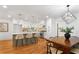 Bright kitchen with white cabinetry, island with seating, and stainless steel appliances at 1020 Pinedale Se Dr, Smyrna, GA 30080