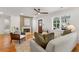 Comfortable living room featuring a fireplace, modern decor, and plenty of natural light from the windows at 1020 Pinedale Se Dr, Smyrna, GA 30080