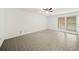 Large bedroom with ceiling fan, light walls, and bright window for natural light at 1126 Berkley Se Dr, Smyrna, GA 30082