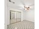 Bedroom with mirrored closet doors and neutral floors, offering ample storage and a clean aesthetic at 1126 Berkley Se Dr, Smyrna, GA 30082