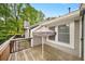 Spacious deck with wood floors and railing provides a pleasant outdoor area for relaxing and grilling at 1126 Berkley Se Dr, Smyrna, GA 30082