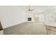 Bright living room features a fireplace, ceiling fan, and bright windows at 1126 Berkley Se Dr, Smyrna, GA 30082