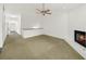 Spacious living room with fireplace, ceiling fan, and ample natural light at 1126 Berkley Se Dr, Smyrna, GA 30082