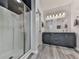 Modern bathroom featuring a large shower with tiled walls and double sink vanity at 121 Riverwatch Ct, Canton, GA 30114