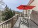Wood deck with comfortable lounge chairs and a shade umbrella at 121 Riverwatch Ct, Canton, GA 30114