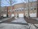 Charming brick townhomes featuring attached garages and well-maintained landscaping at 121 Riverwatch Ct, Canton, GA 30114