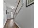 Bright hallway with wooden floors and staircase to upper level at 121 Riverwatch Ct, Canton, GA 30114
