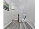 Hallway with hardwood style floors and white walls leading to the downstairs area at 121 Riverwatch Ct, Canton, GA 30114