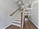 Bright hallway with wooden floors and staircase to upper level at 121 Riverwatch Ct, Canton, GA 30114