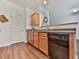 The kitchen features wooden cabinets, stone countertops and stainless steel appliances at 121 Riverwatch Ct, Canton, GA 30114
