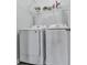 Convenient laundry room with washer and dryer, plus storage shelves at 121 Riverwatch Ct, Canton, GA 30114