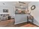 Inviting living room and kitchen area with hardwood flooring and stainless steel appliances at 121 Riverwatch Ct, Canton, GA 30114