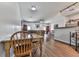 Open concept dining and living area featuring hardwood floors, natural light, and neutral paint at 121 Riverwatch Ct, Canton, GA 30114