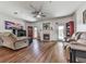 Bright and open living room features hardwood floors, ceiling fan and fireplace at 121 Riverwatch Ct, Canton, GA 30114