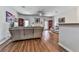 Bright and open living room features hardwood floors, ceiling fan and fireplace at 121 Riverwatch Ct, Canton, GA 30114
