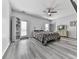 Spacious bedroom featuring hardwood floors, neutral walls, and a ceiling fan at 121 Riverwatch Ct, Canton, GA 30114