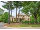Beautiful brick home with lush landscaping, a balcony, and large windows offering abundant natural light at 3299 Carmichael Pl, Duluth, GA 30097