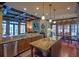 Expansive kitchen with granite countertops, coffered ceilings, stainless appliances, and breakfast area at 3299 Carmichael Pl, Duluth, GA 30097